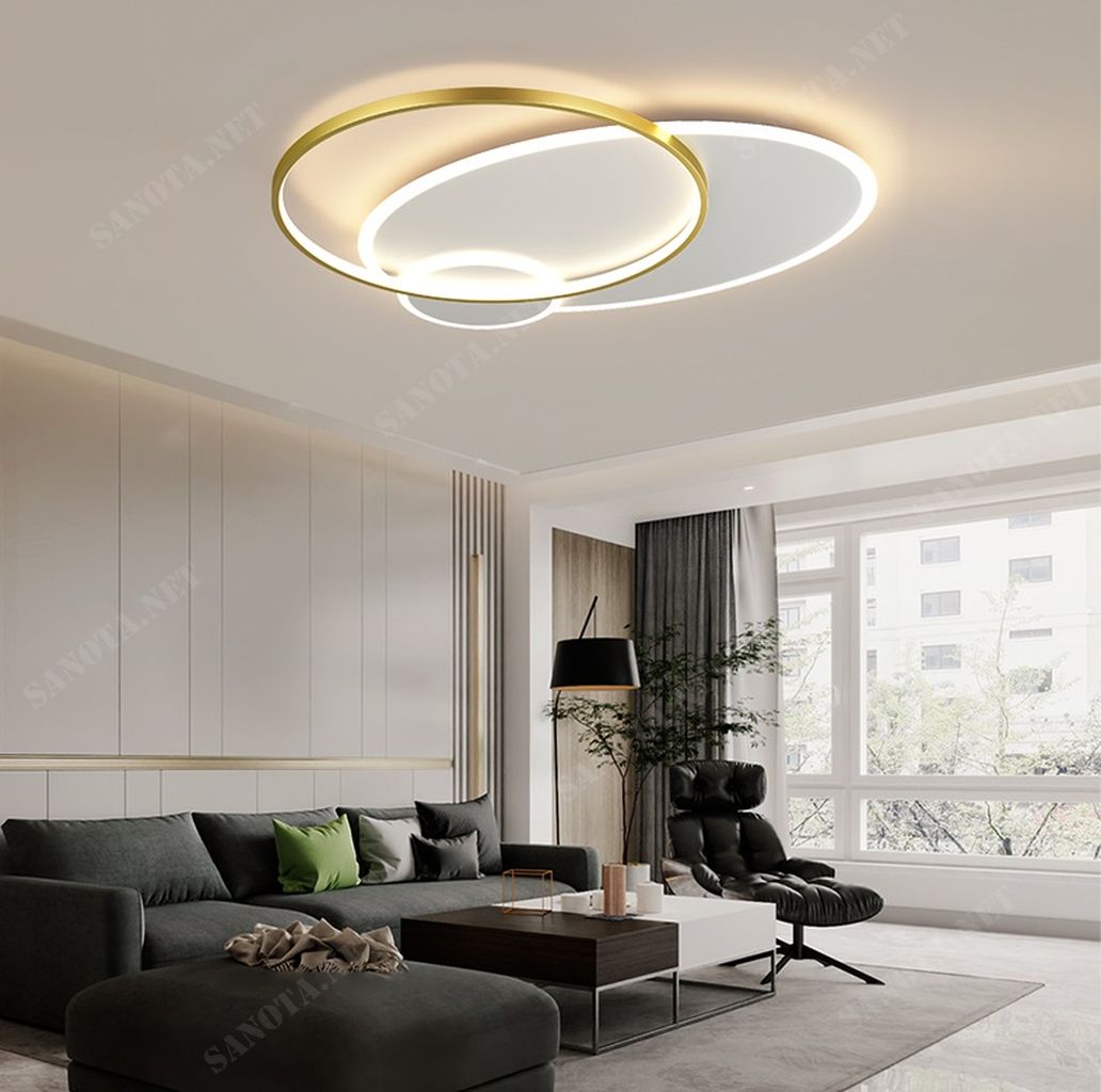 Chiếc đèn ốp trần này thật sự là một tuyệt tác của sự tinh tế và sang trọng. Với thiết kế là một mâm đèn LED tròn hiện đại. Chiếc đèn này hòa quyện giữa vẻ đẹp của màu trắng tinh khôi của mâm đèn LED và sự sang trọng của vòng tròn đèn LED màu vàng.