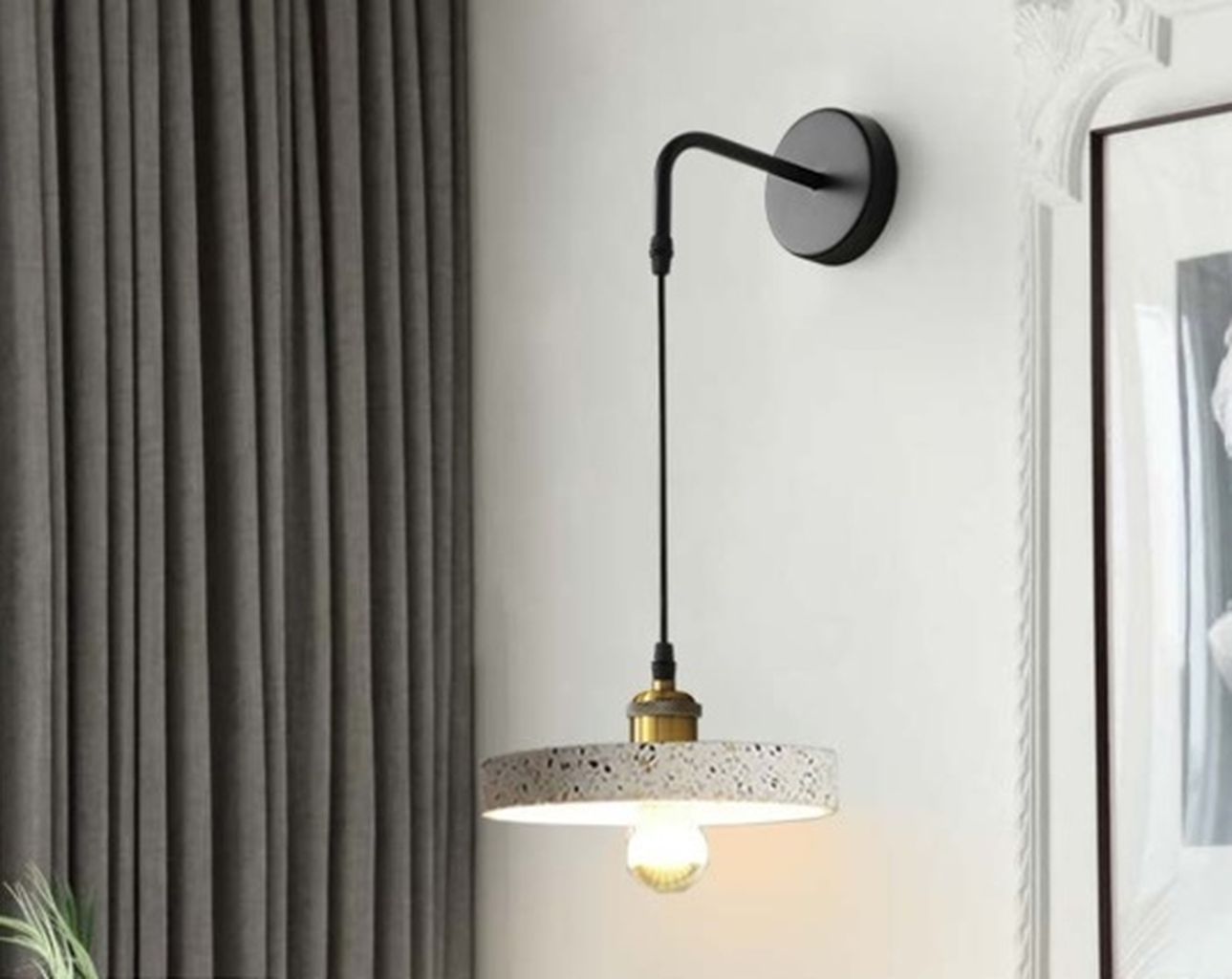 Đèn tường chao đá mài sợi khảm xà cừ được mài thủ công từ hỗn hợp bê tông đá rửa trộn với sợi thủy tinh composite. Mỗi chiếc đèn được mài thủ công bằng tay. Mang đến một vẻ đẹp mộc mạc, tinh tế mà không kém phần sang trọng. Với thiết kế gắn tường thả độc đáo, đèn mang lại sự chuyển mình nhẹ nhàng từ nét công nghiệp sang vẻ đẹp mộc mạc hiện đại. Phần chao đèn được chế tác từ chất liệu composite đá mài cao cấp. Điểm xuyết các hạt khảm trai tự nhiên lấp lánh, mang đến chiều sâu thị giác đầy cuốn hút. Mỗi chiếc đèn là một mảnh ghép hoàn thiện từ chất liệu và nghệ thuật thủ công. Tạo nên cảm giác gần gũi nhưng không kém phần sang trọng.